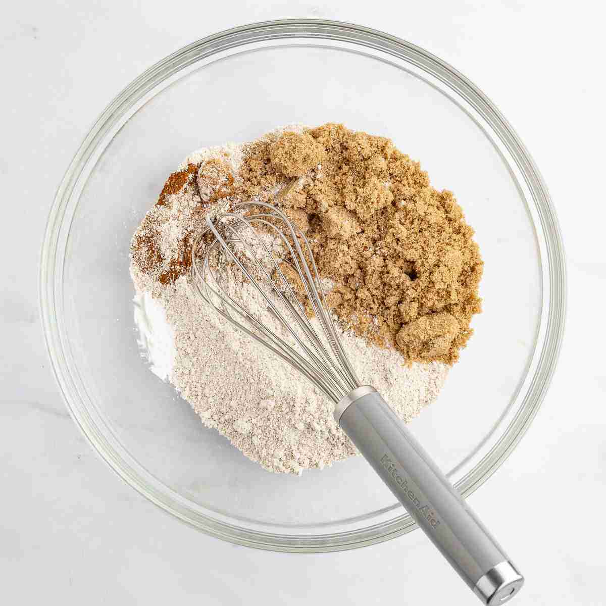 mixing bowl with dry ingredient for apple oatmeal cake