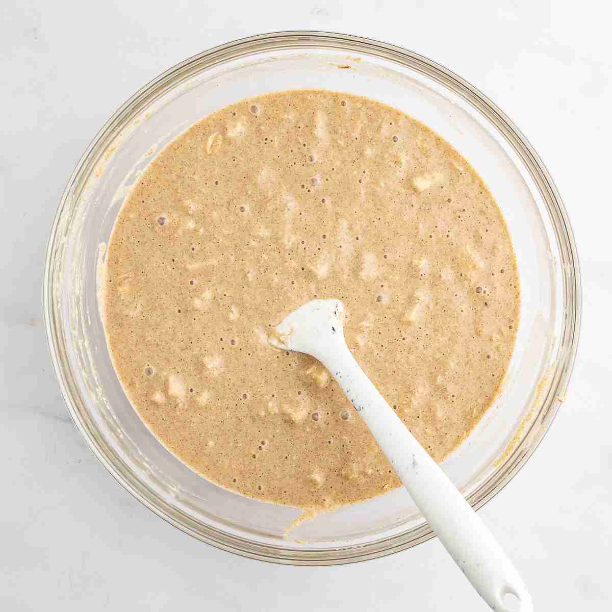 mixing bowl with finished batter for apple oatmeal cake