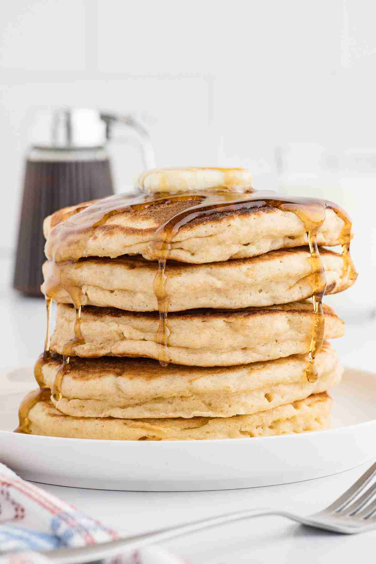 a stack of fresh milled flour pancakes with butter and syrup