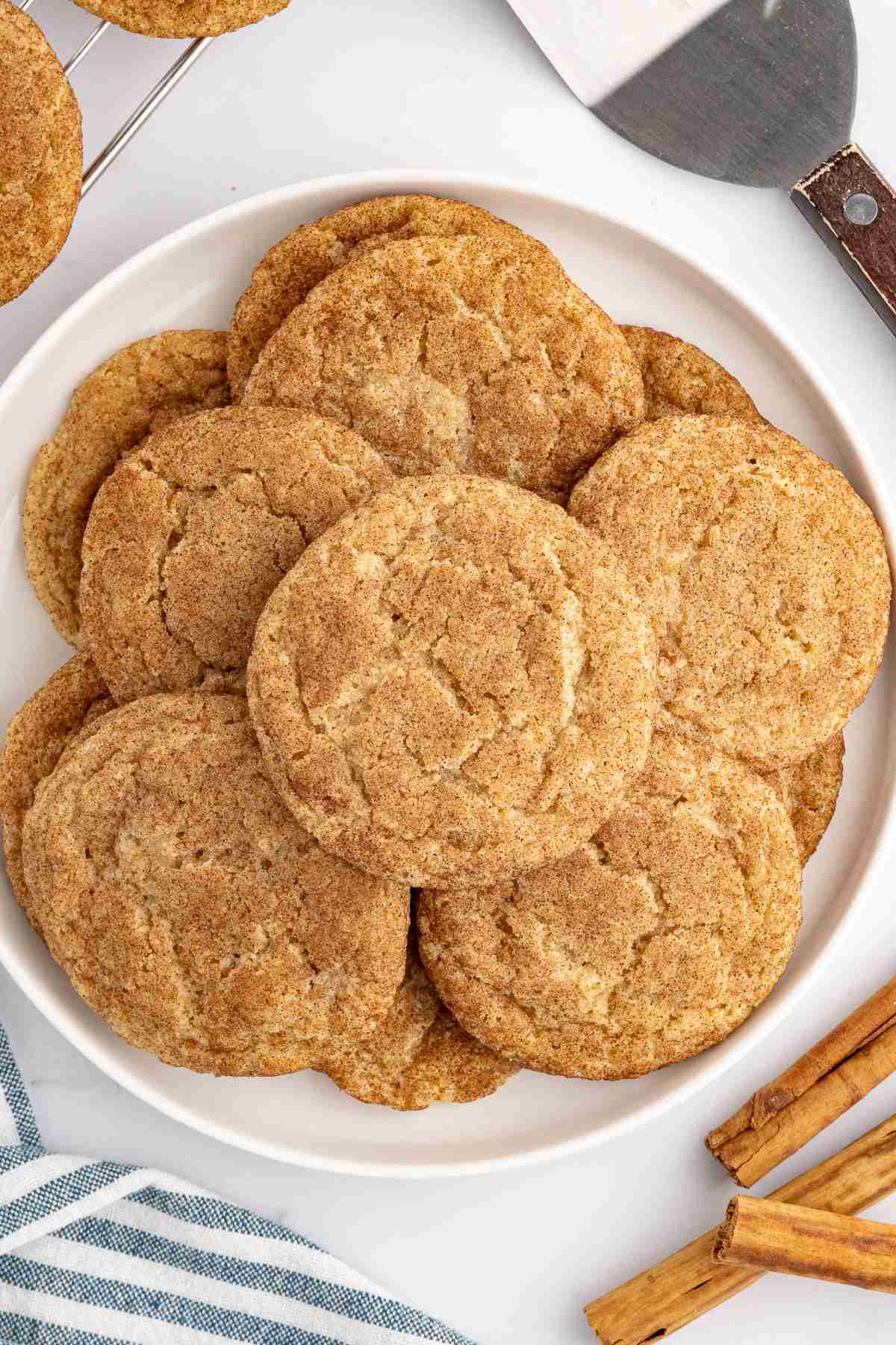cinnamon snickerdoodles made with fresh milled flour on a white plate seen from overhead