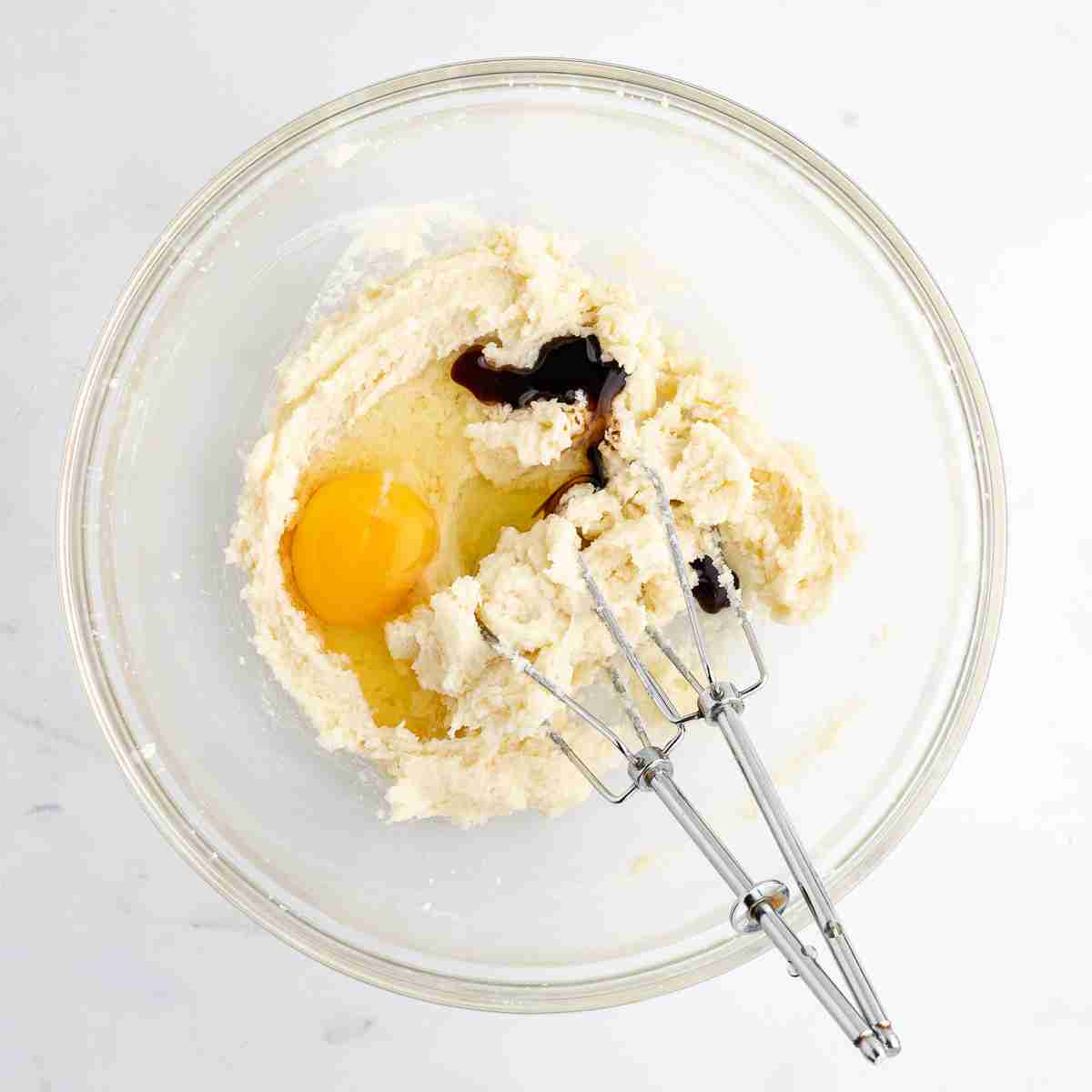 mixing bowl with creamed sugar with egg and vanilla added