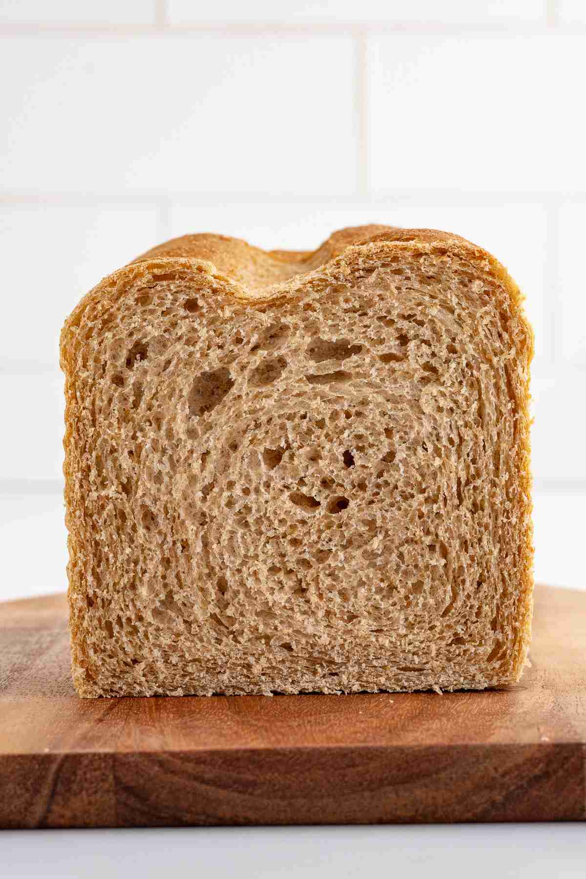 straight view of cut fresh milled flour sandwich bread loaf showing inside texture