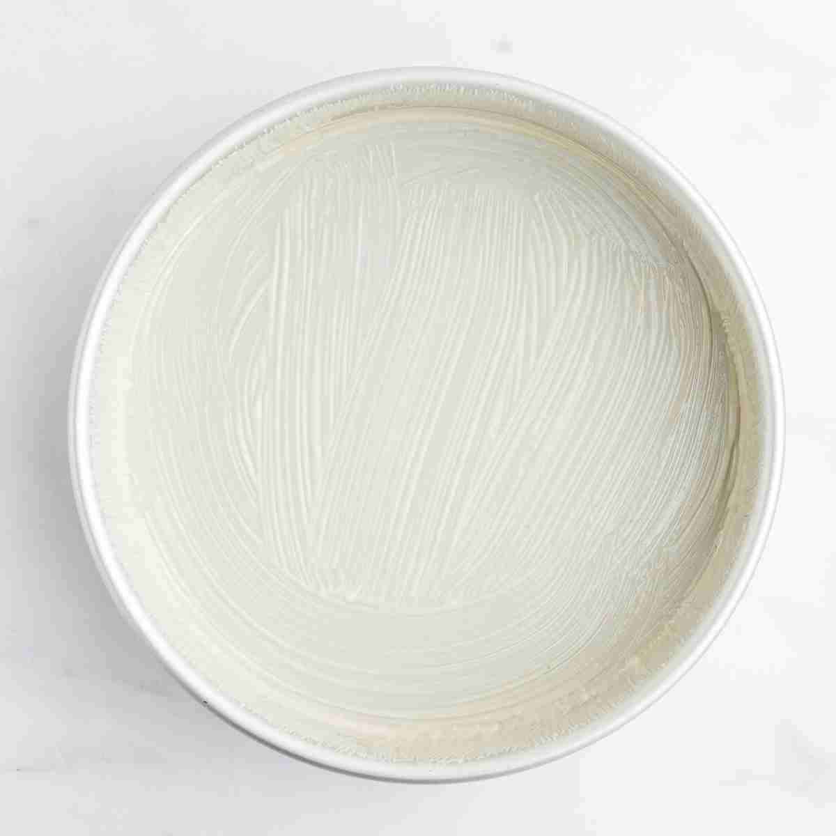 a baking pan with cake release spread on it