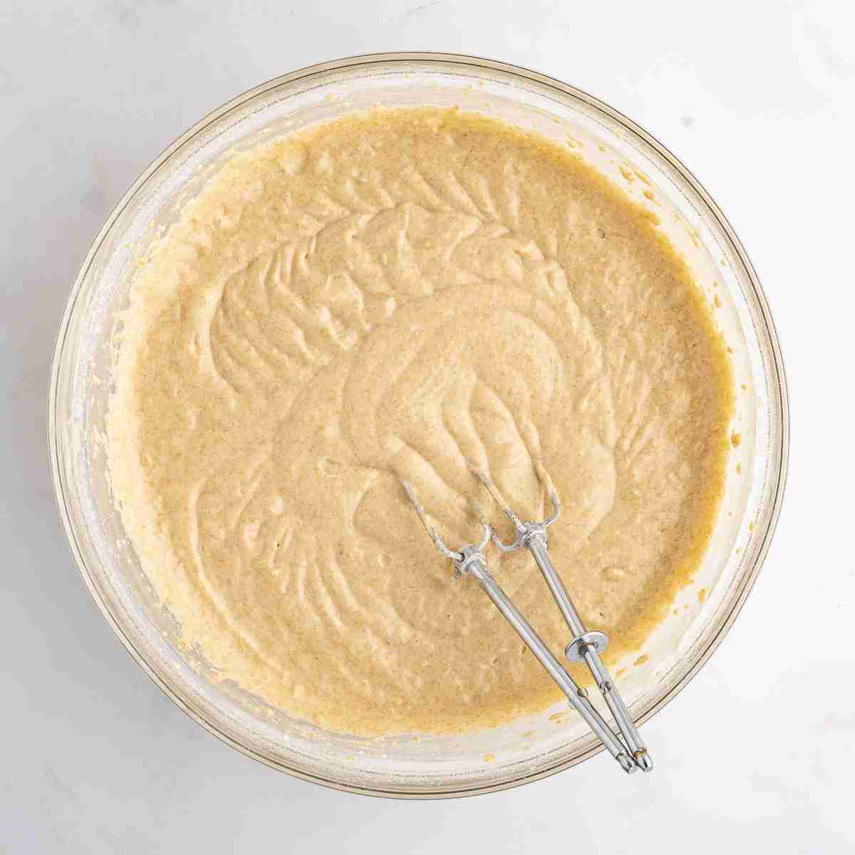 mixing bowl showing finished fresh milled yellow cake batter