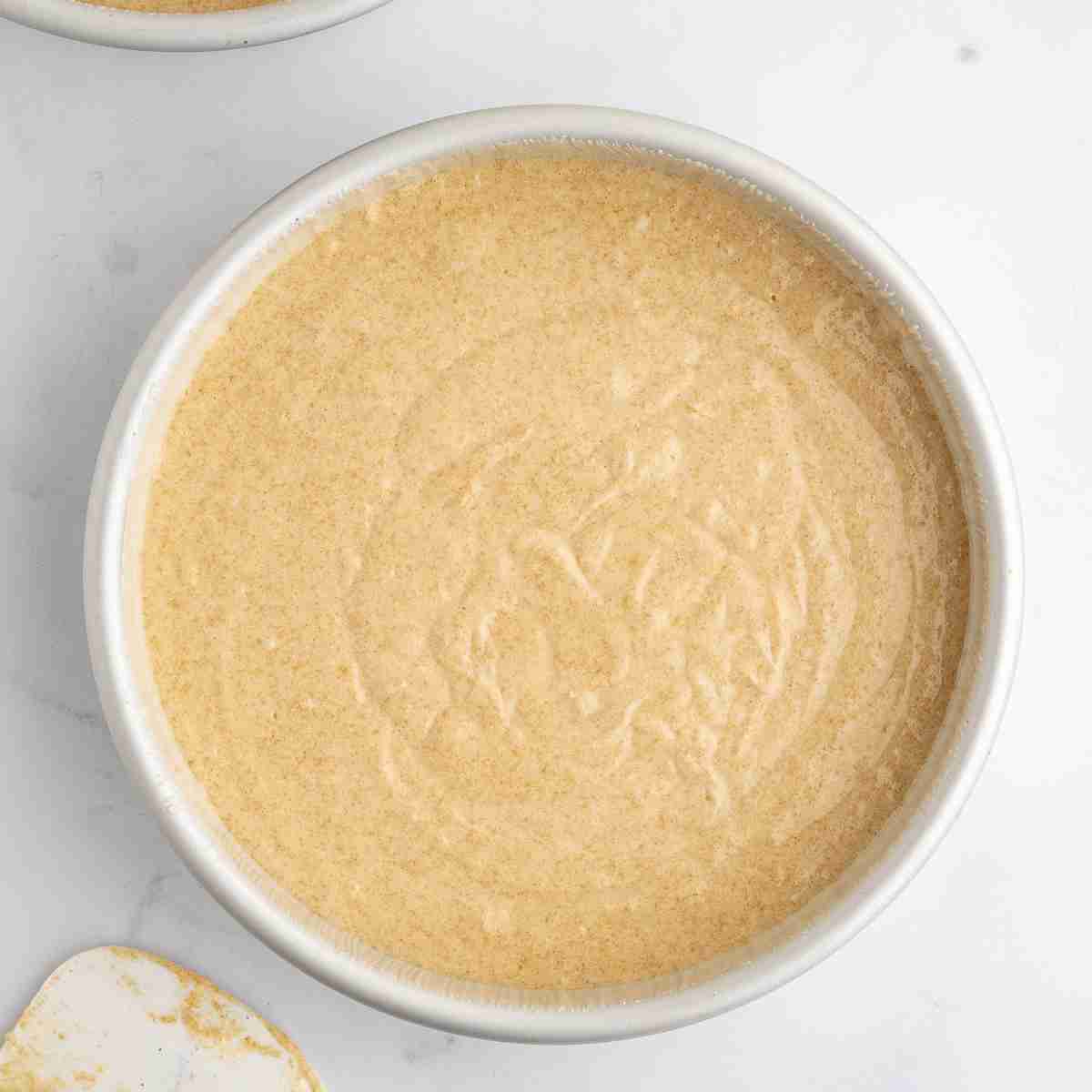 cake pan with fresh milled cake batter ready for oven