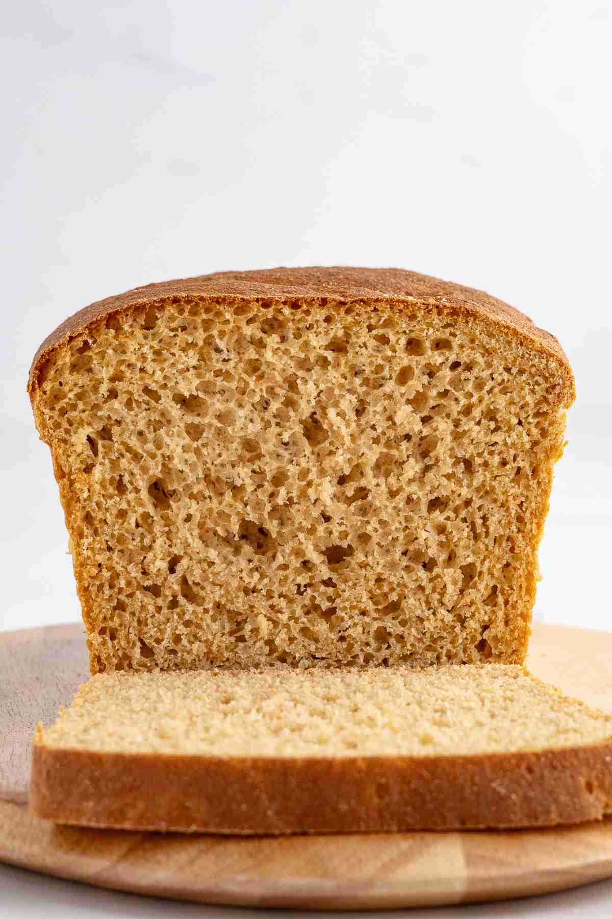 straight on close up of cut fresh milled English muffin bread showing inside texture