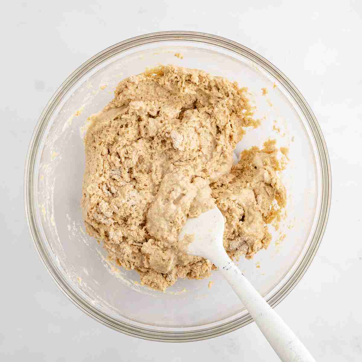 mixing bowl with dough after mixing dry and wet ingredients for fresh milled English muffin toasting bread