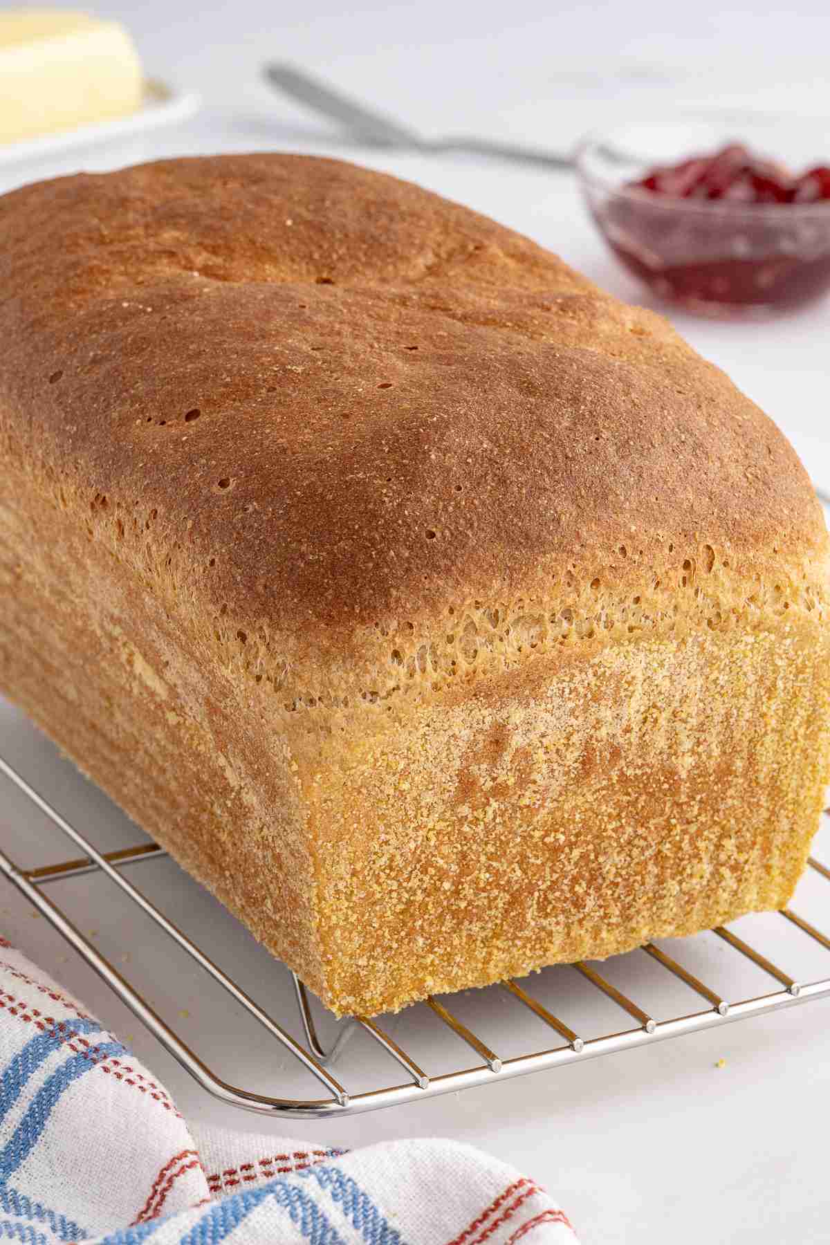 baked fresh milled English muffin toasting bread on cooling rack