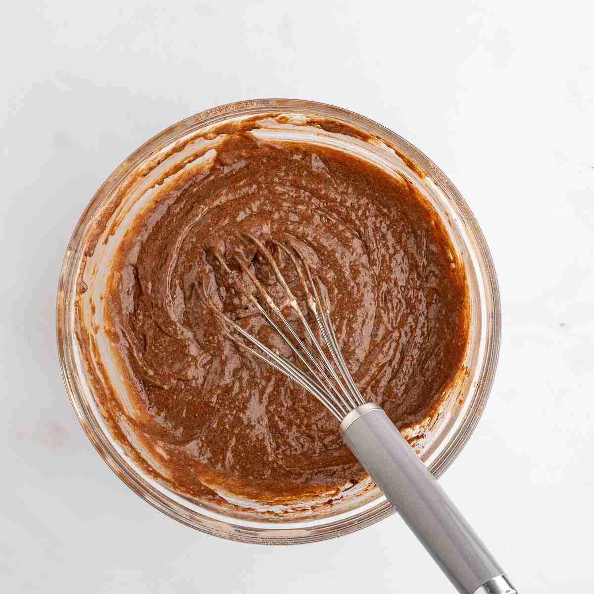 mixing bowl with fresh milled chocolate cupcake batter after whisking wet ingredients