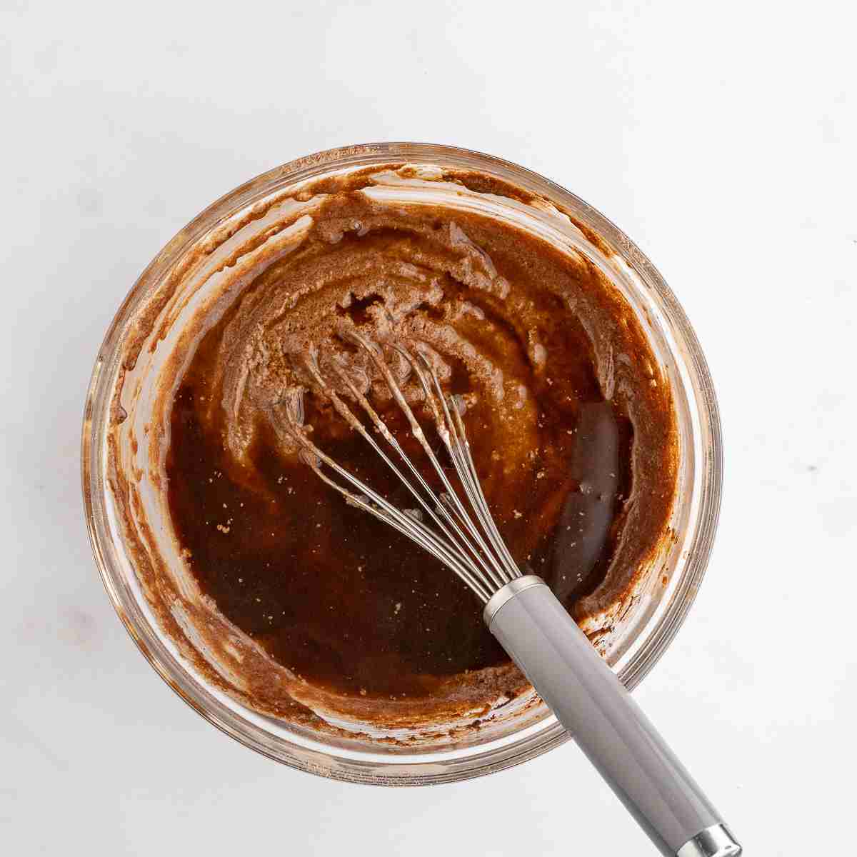 mixing bowl with boiling water and espresso powder added in ready to whisk